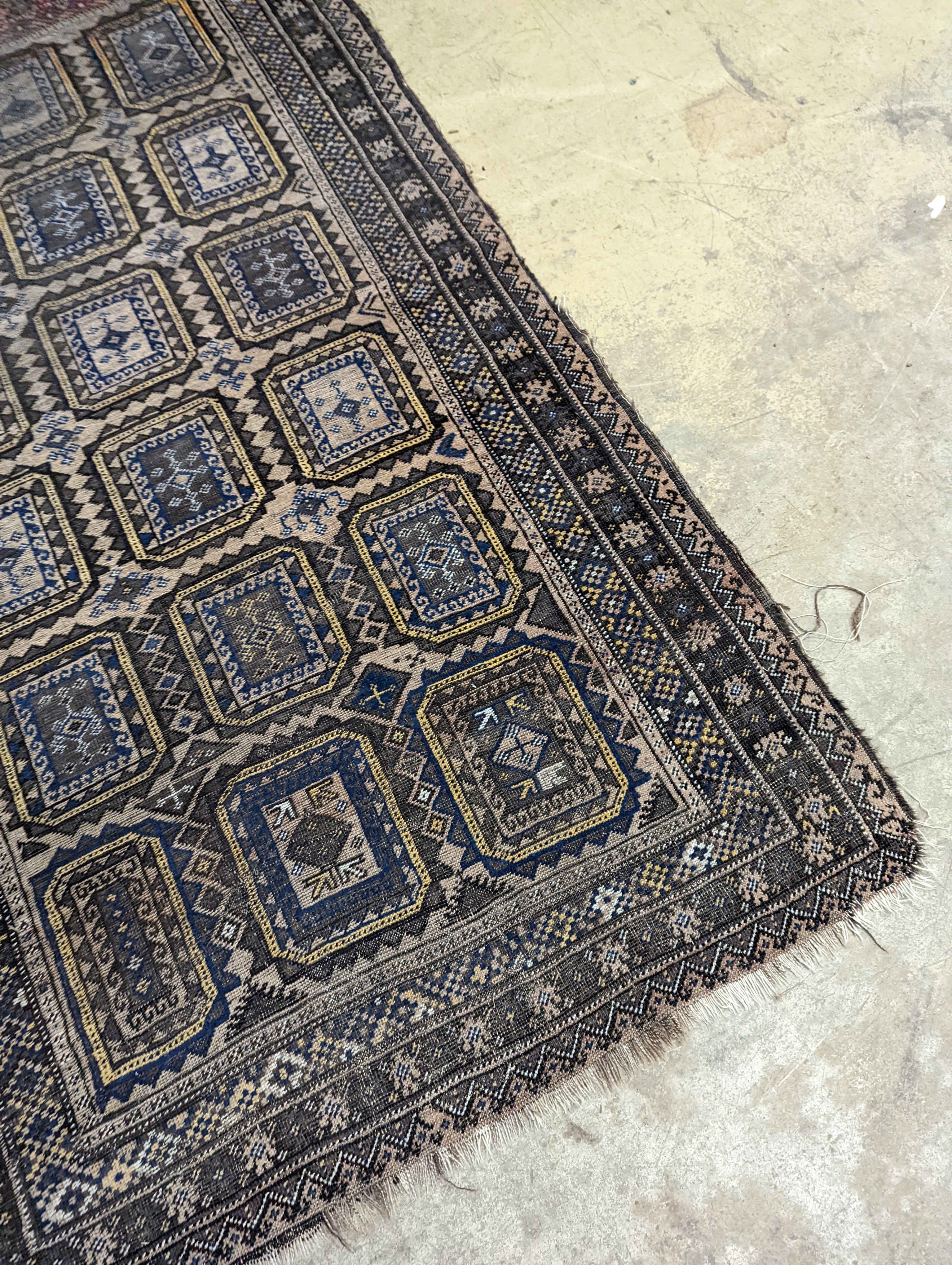 A Belouch geometric rug, 216 x 130cm. together with four Kelim cushion covers